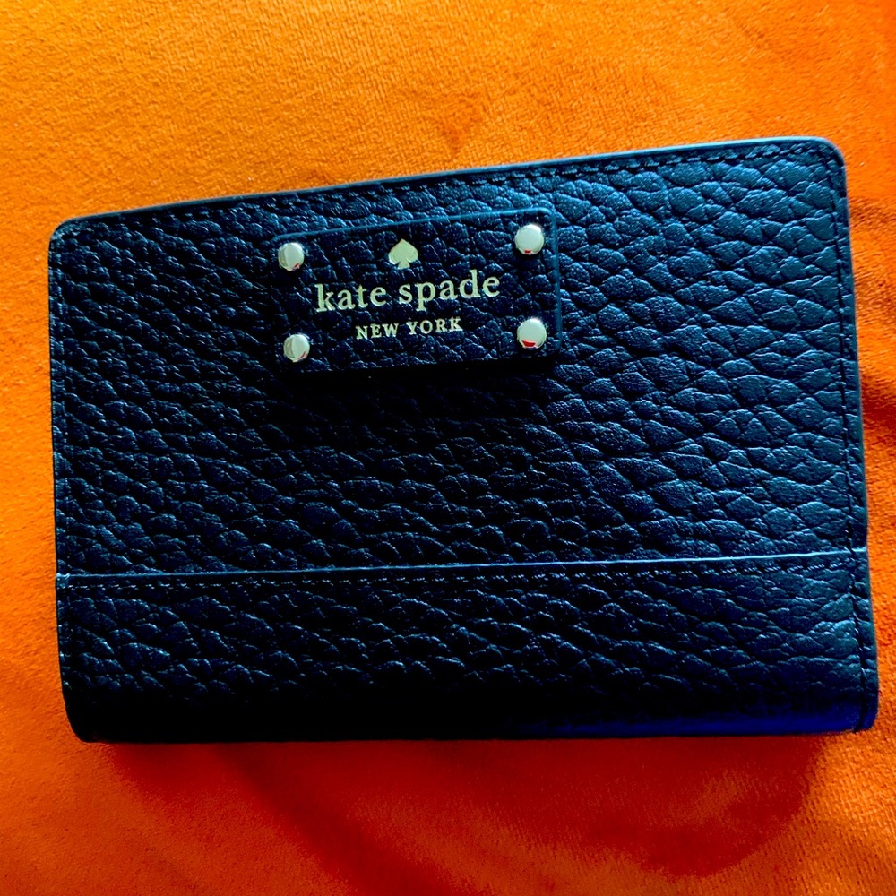 Kate Spade NWOT Tellie wallet. Pristine condition.